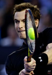 Andy Murray of Britain makes a backhand return to Nick Kyrgios of Australia during their quarterfinal match at the Australian Open tennis championship in Melbourne, Australia, Tuesday, Jan. 27, 2015.